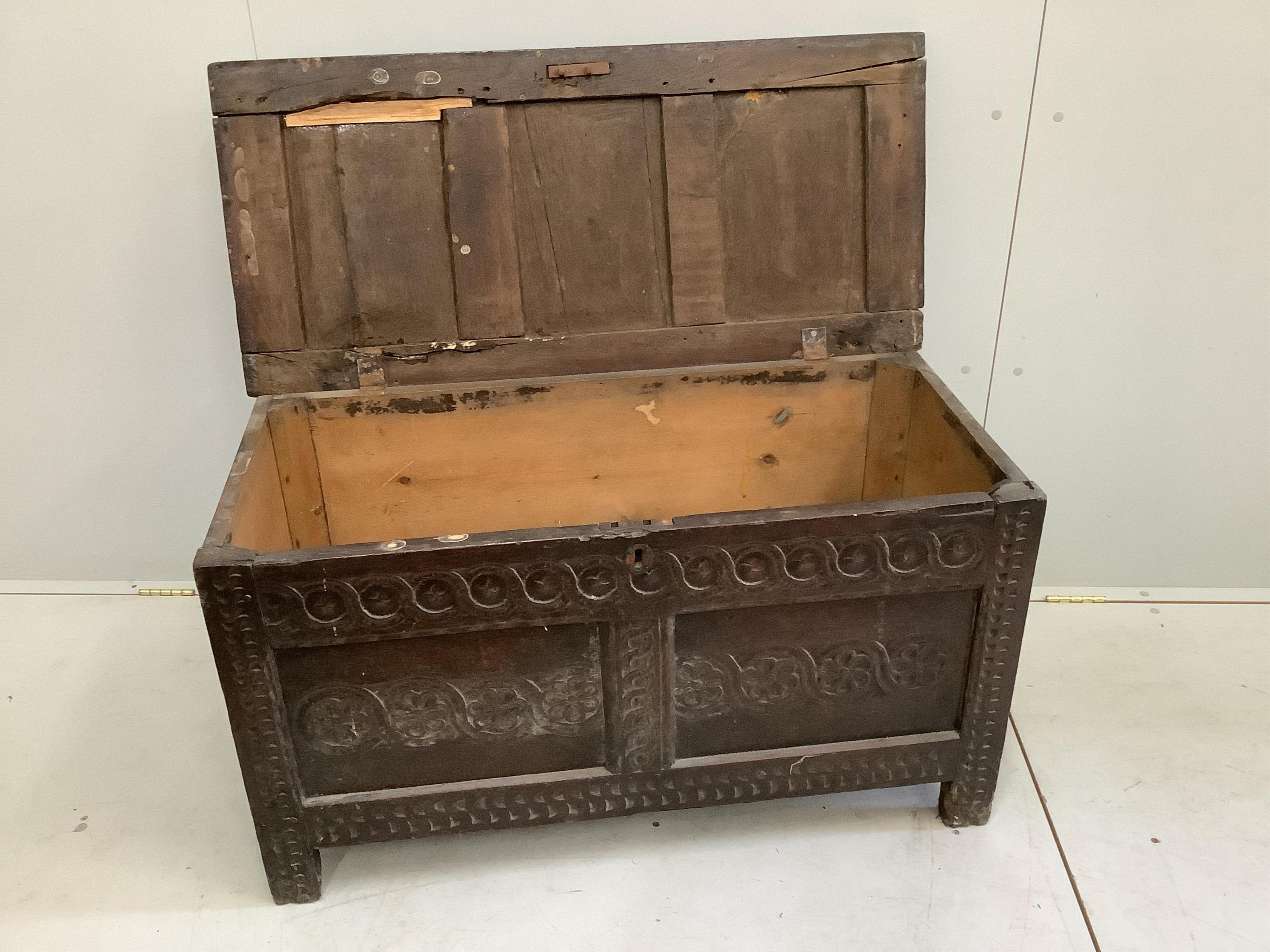 A 17th century oak coffer, width 106cm, depth 48cm, height 59cm